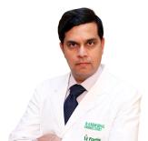 Dr. Karun  Behal