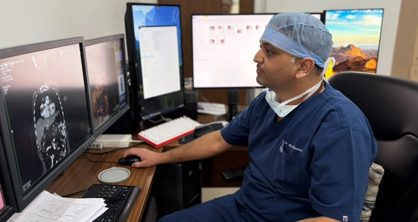 Dr. Naval Bansal reviewing standard and contrast-enhanced mammogram images at Fortis Hospital Mohali.