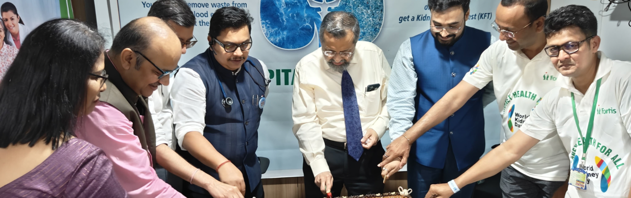 senior doctors and heads cutting a cake for world kidney day 